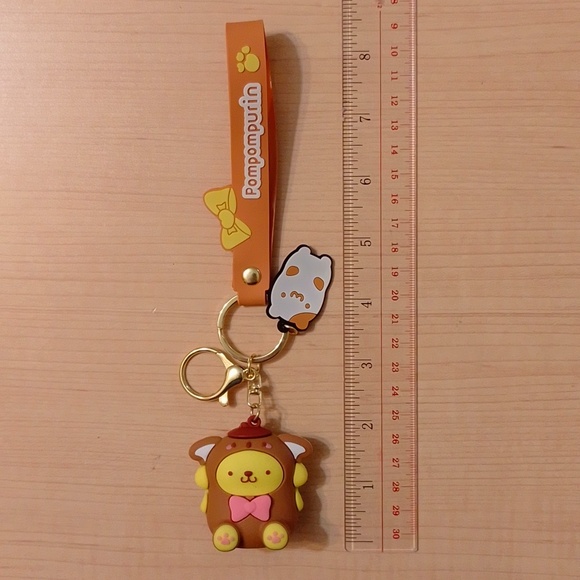 🆕 Sanrio Pompompurin Figurine Keychain Bag Clip - Picture 8 of 9